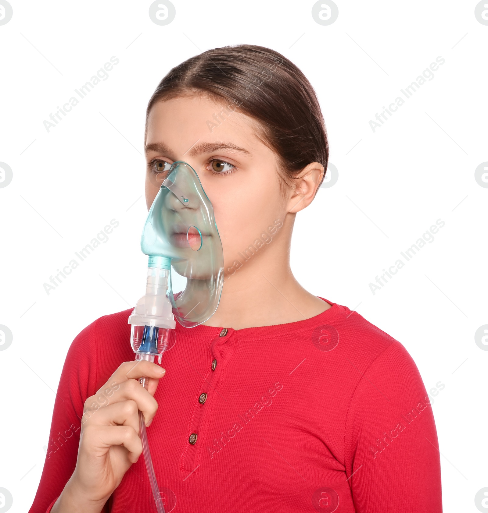 Photo of Cute girl using nebulizer for inhalation on white background