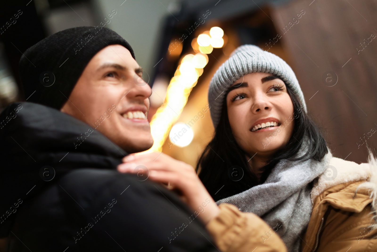 Photo of Lovely couple on city street. Winter vacation