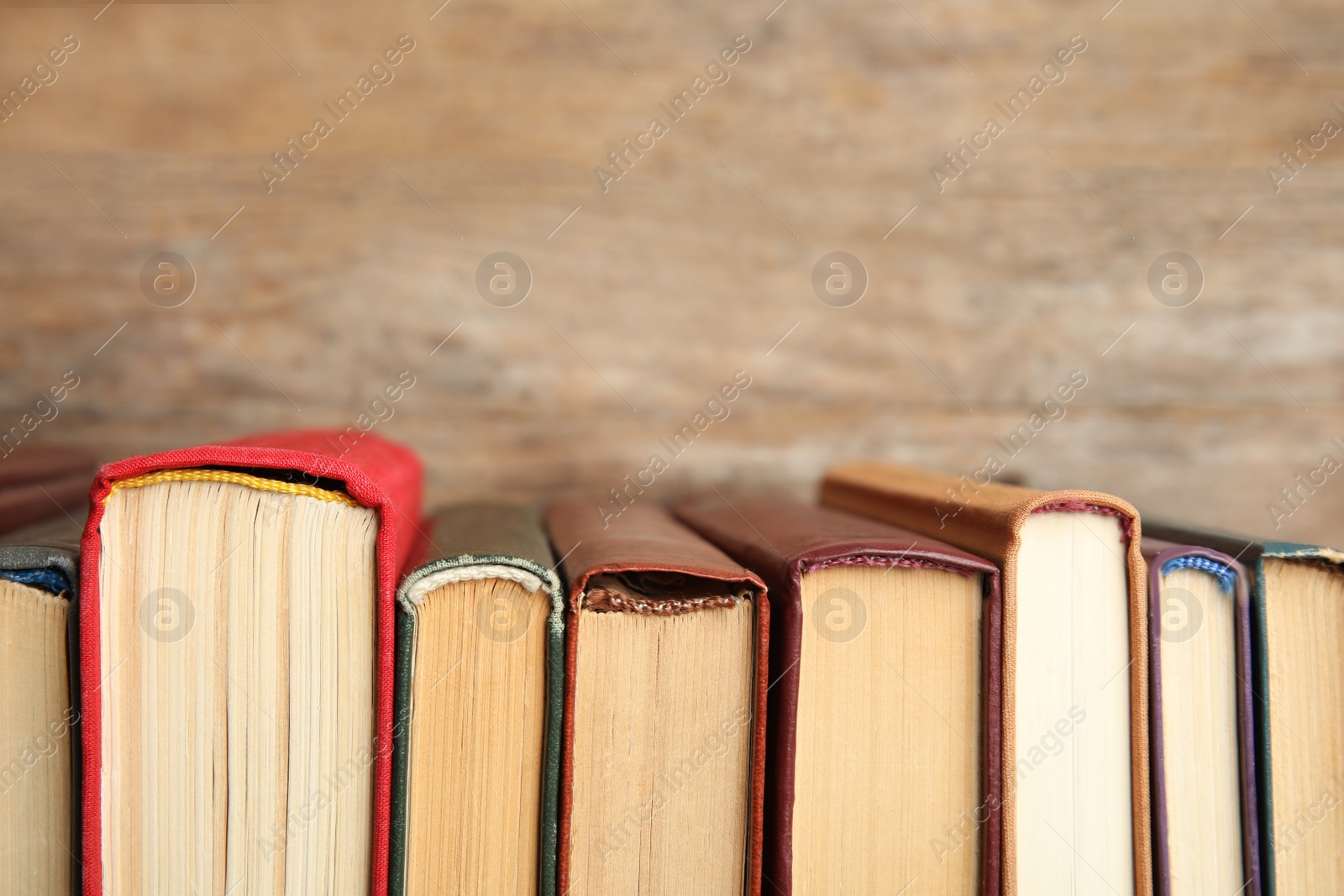 Photo of Collection of old books on wooden background