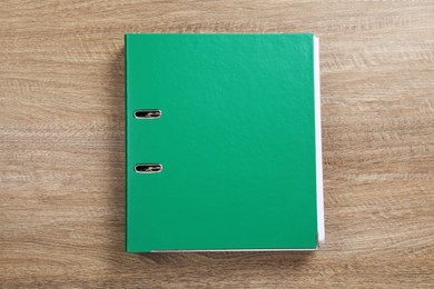 Photo of Green office folder on wooden table, top view
