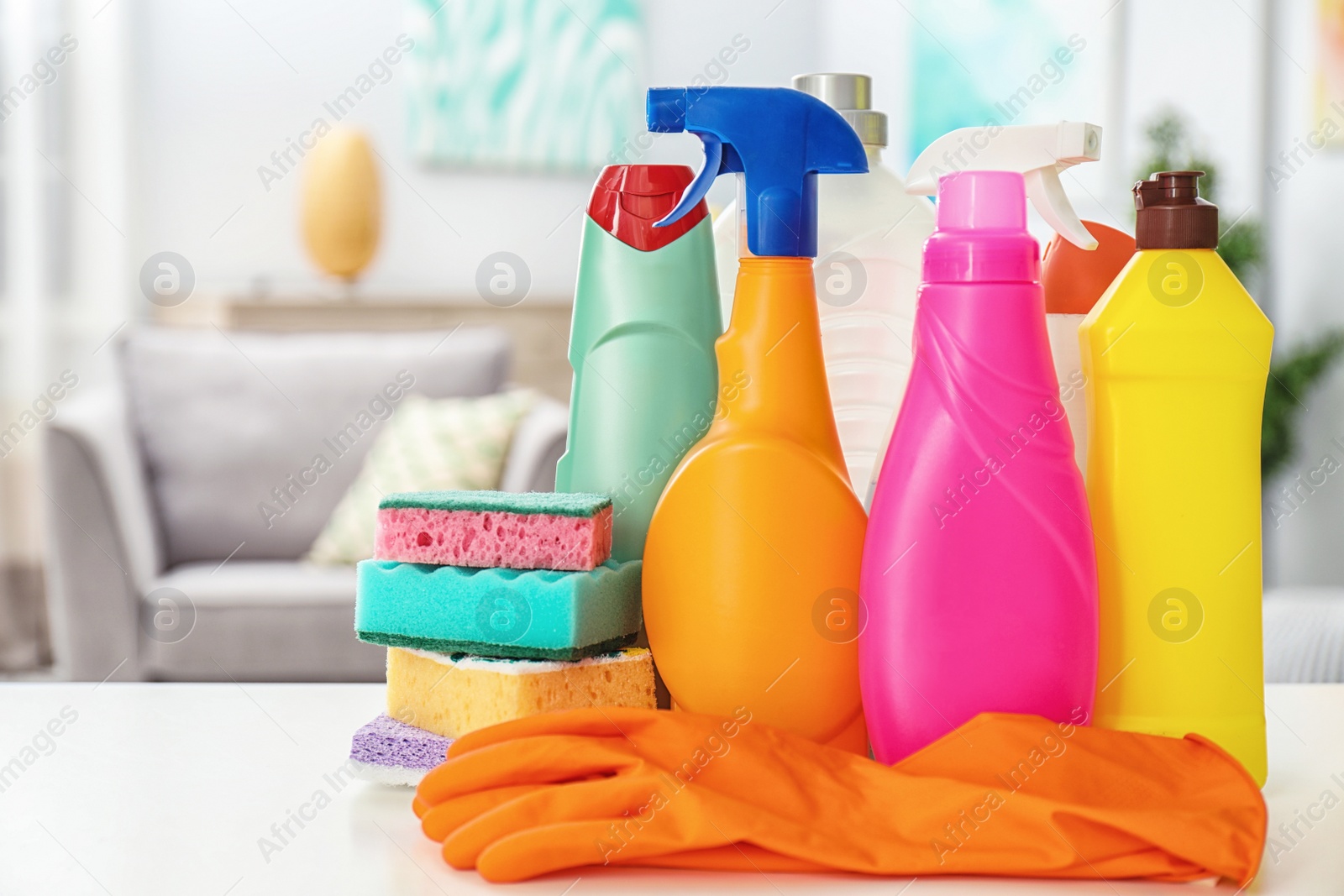 Photo of Set of cleaning supplies on table indoors