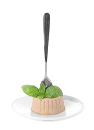 Plate of delicious meat pate with basil and fork isolated on white