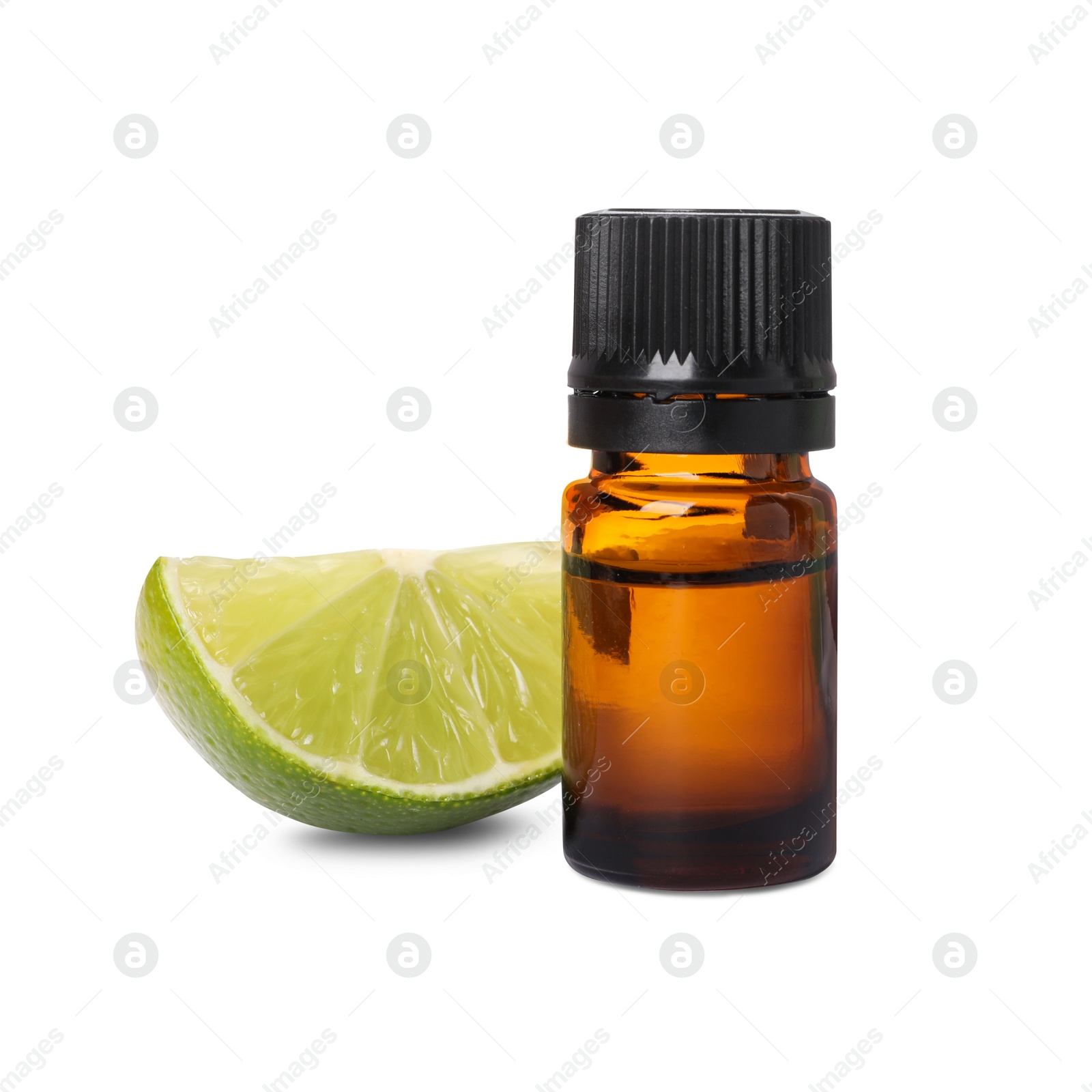 Photo of Bottle of citrus essential oil and cut fresh lime isolated on white