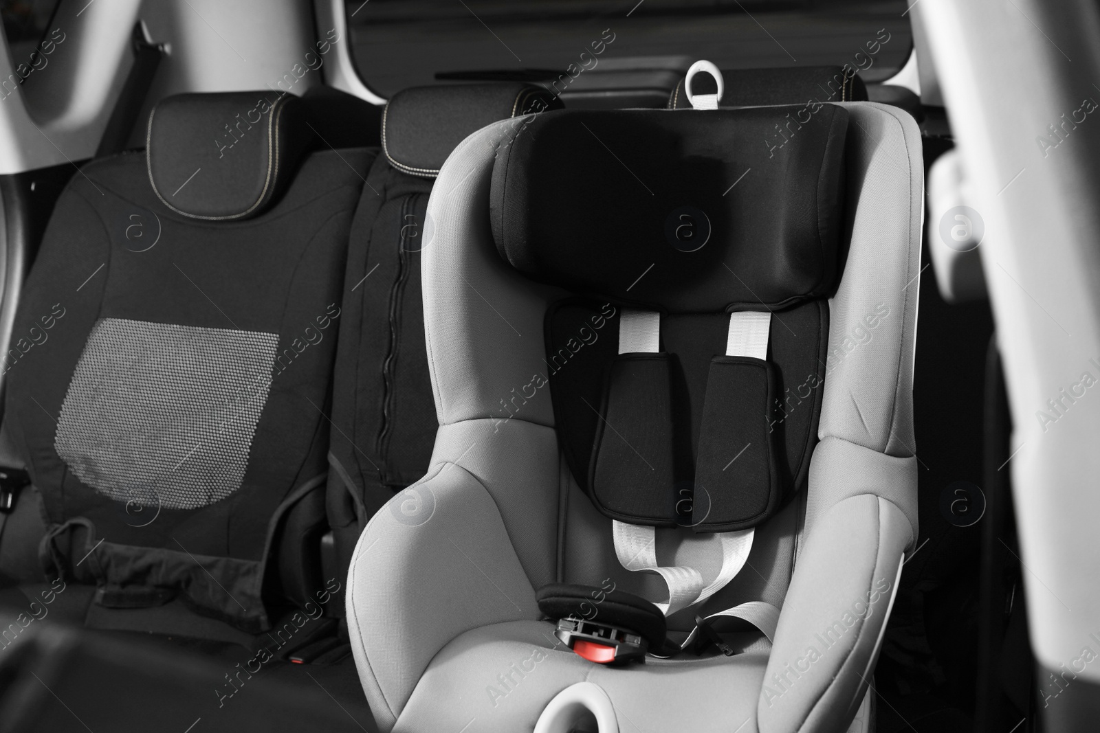 Photo of Empty baby seat inside car. Child safety