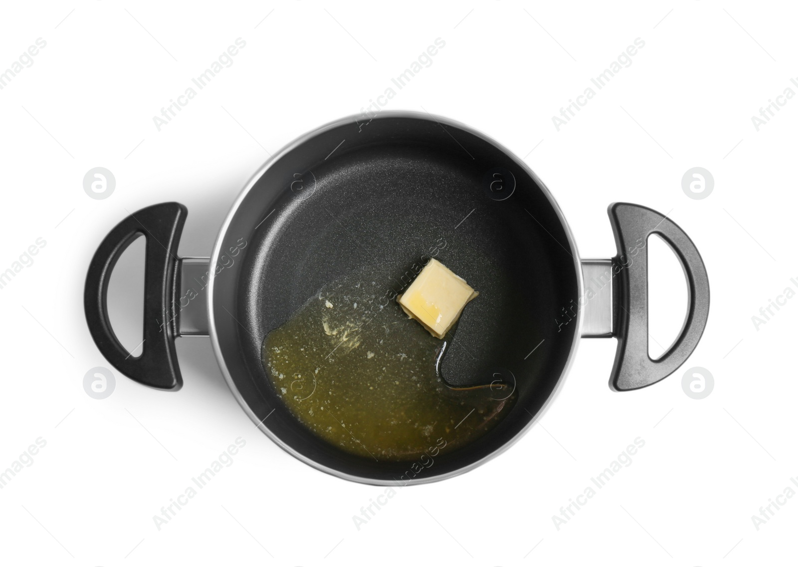 Photo of Pot with melting butter on white background, top view