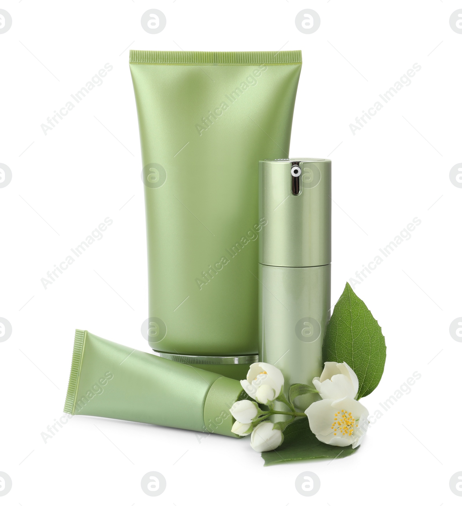 Photo of Set of cosmetic products and flowers isolated on white