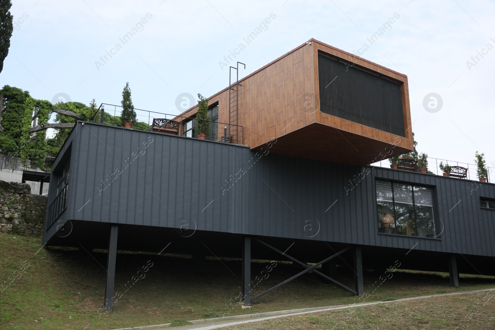 Photo of Georgia, Tsikhisdziri - July 07, 2022: Modern building of touristic center near Petra fortress