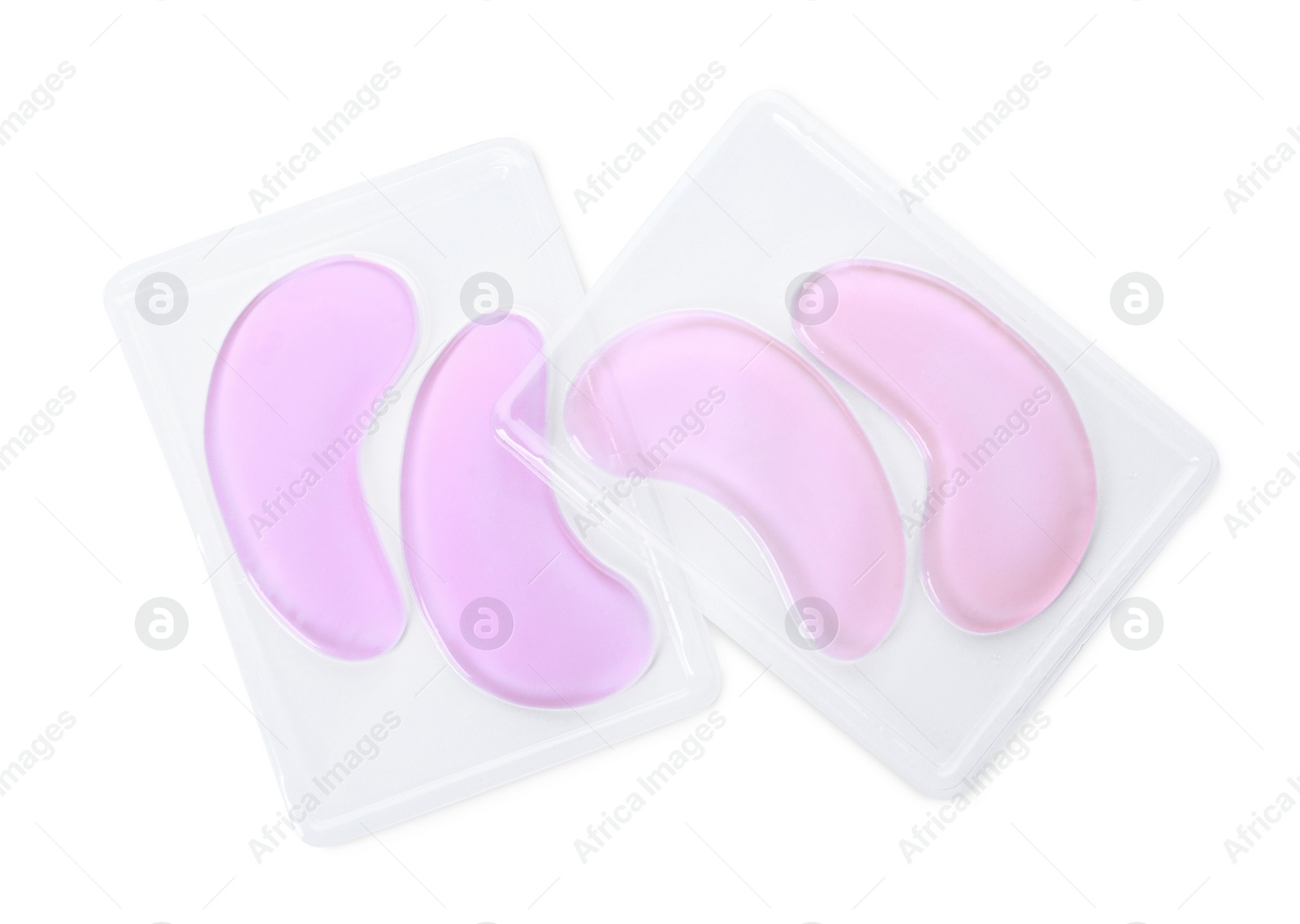 Photo of Packages with under eye patches isolated on white, top view. Cosmetic product