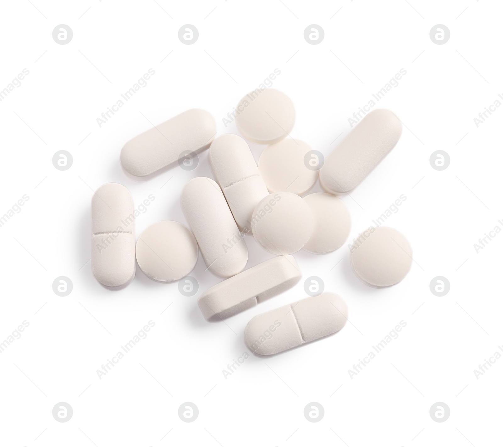 Photo of Many pills isolated on white, top view