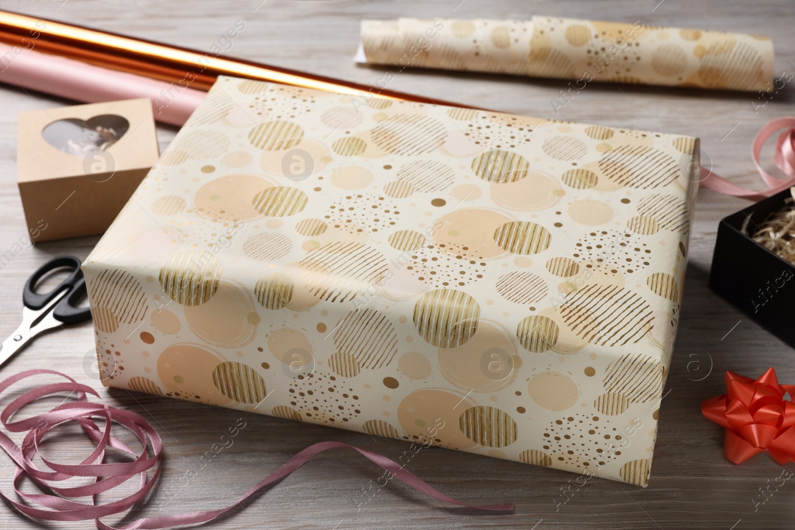 Photo of Beautifully wrapped gift boxes on wooden table