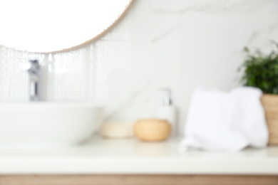 Blurred view of stylish modern bathroom with toiletries