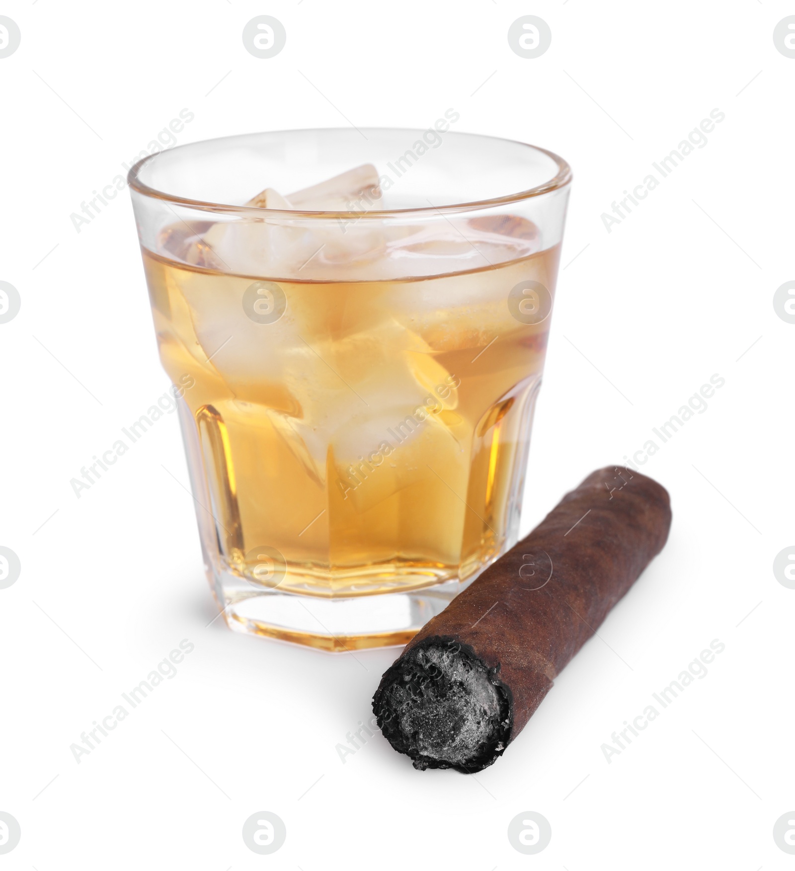 Photo of Glass of whiskey and burnt cigar isolated on white