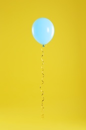 Bright balloon on color background. Celebration time