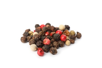 Photo of Mix of peppercorns on white background. Aromatic spice