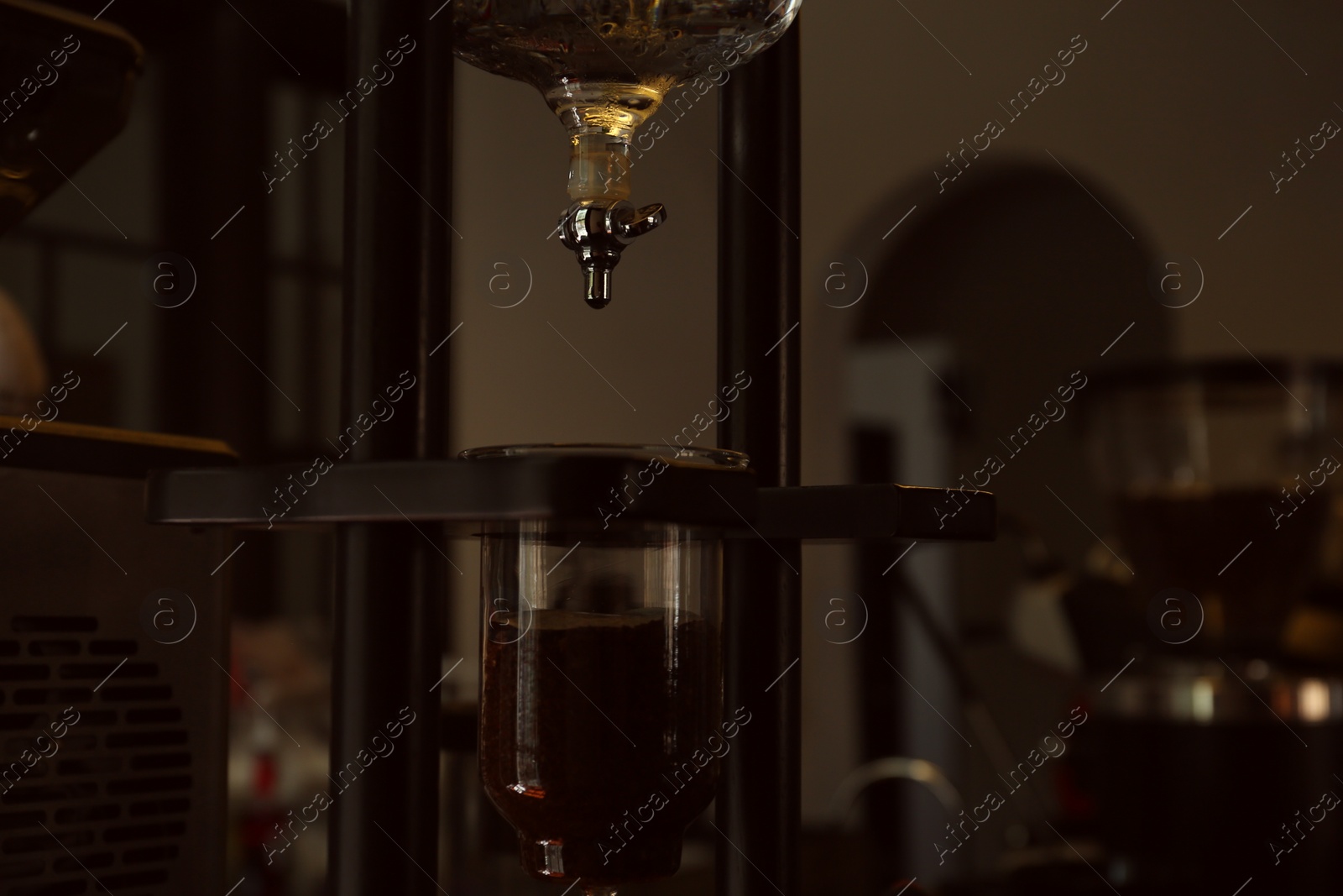 Photo of Professional vacuum coffee maker in cafe, closeup. Space for text