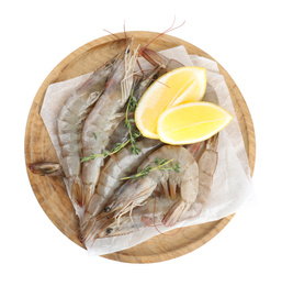 Wooden plate with raw shrimps, lemon slices and thyme isolated on white, top view