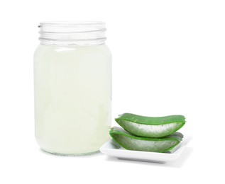 Photo of Fresh aloe juice in jar and cut leaves isolated on white