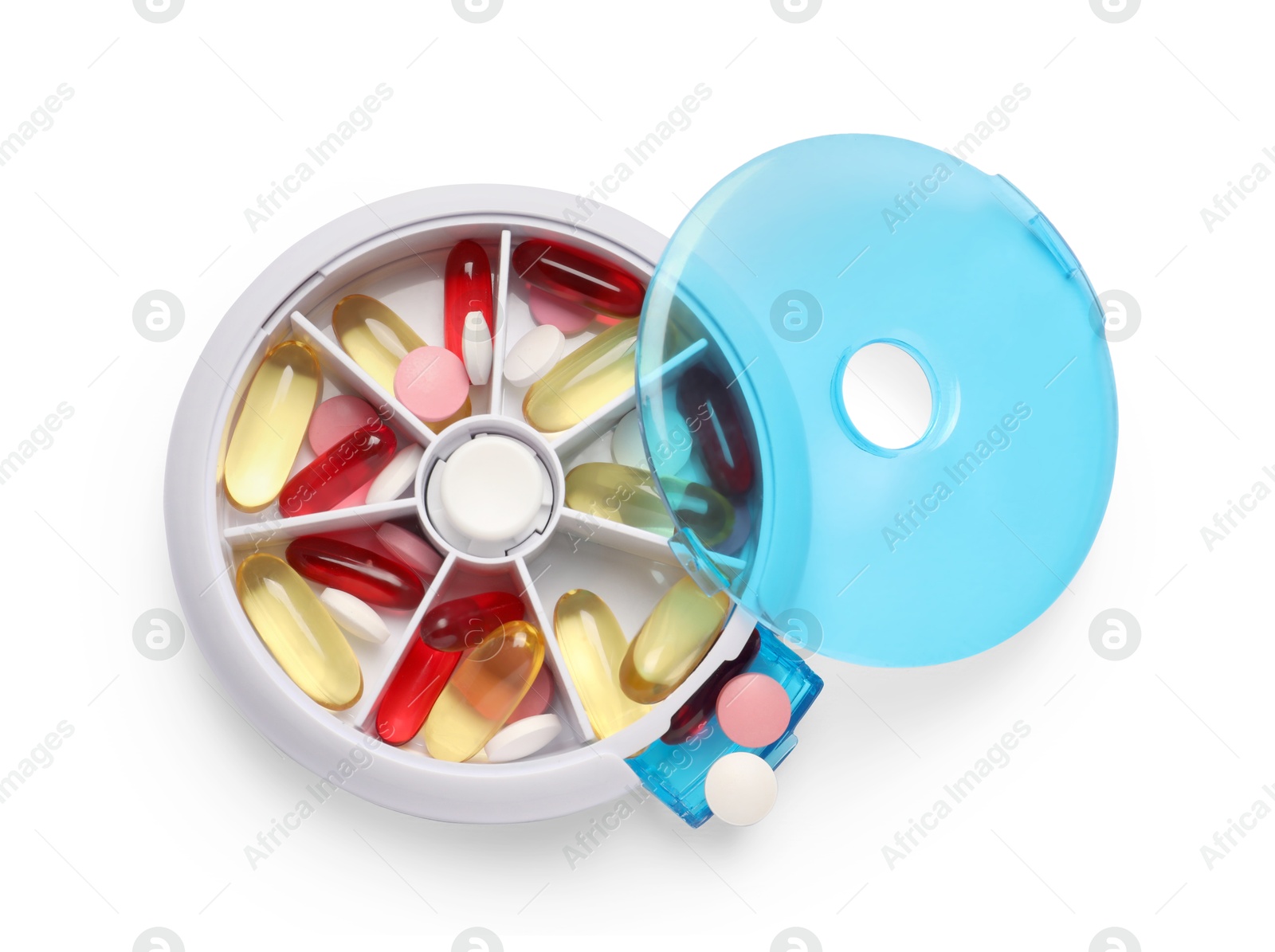 Photo of Different pills in organizer isolated on white, top view