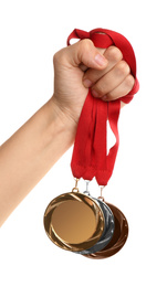 Woman holding medals on white background, closeup. Space for design