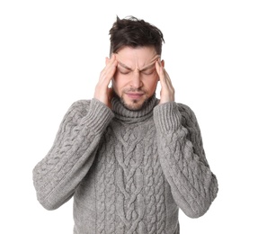 Man suffering from headache on white background