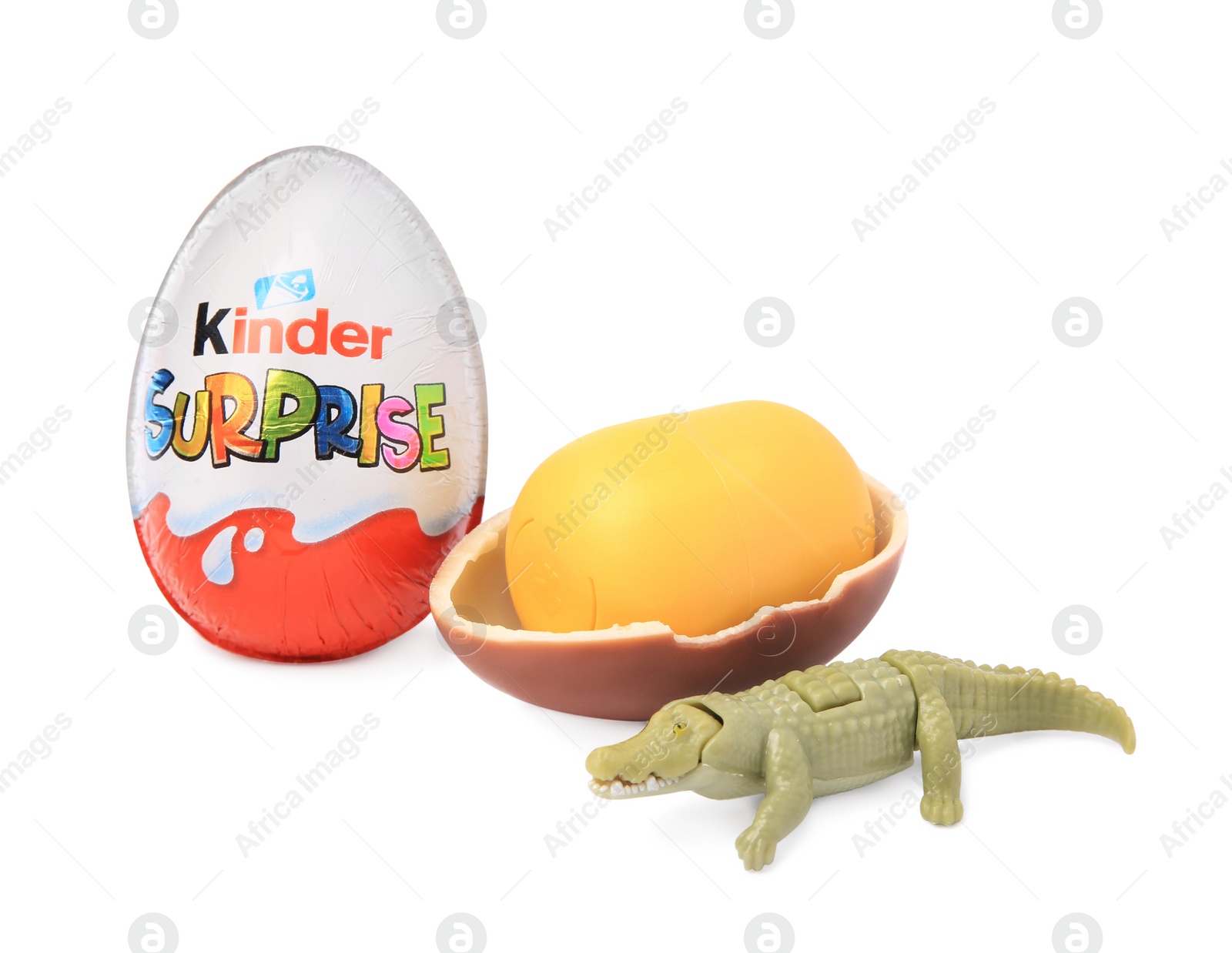 Photo of Slynchev Bryag, Bulgaria - May 24, 2023: Kinder Surprise Eggs, plastic capsule and toy crocodile isolated on white