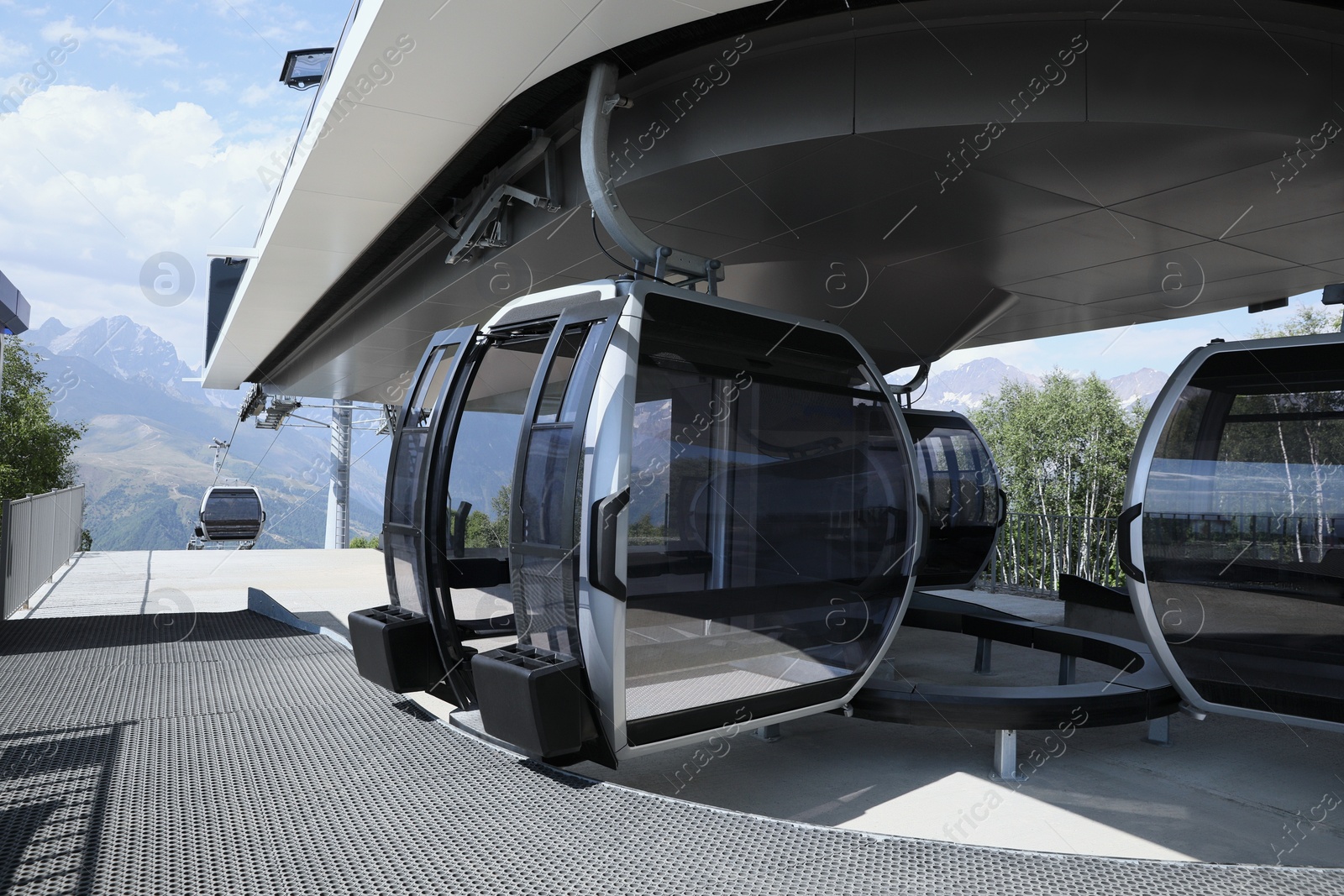 Photo of Modern large cabins on cableway near mountain outdoors