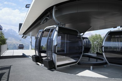 Modern large cabins on cableway near mountain outdoors