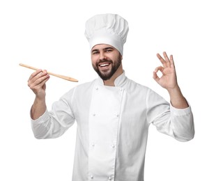 Photo of Happy young chef in uniform tasting something and showing ok gesture on white background