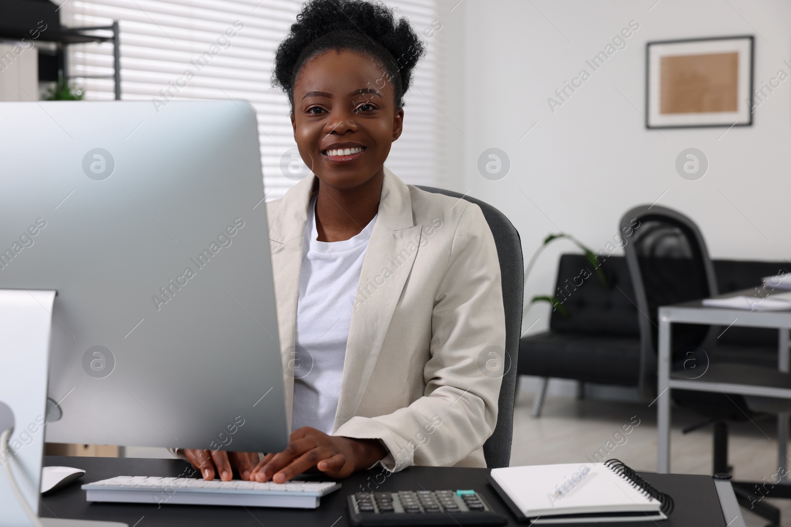 Photo of Professional accountant working on computer at desk in office. Space for text