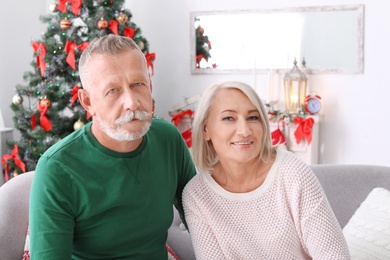 Mature couple together at home. Christmas celebration