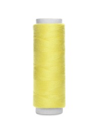 Spool of yellow sewing thread isolated on white