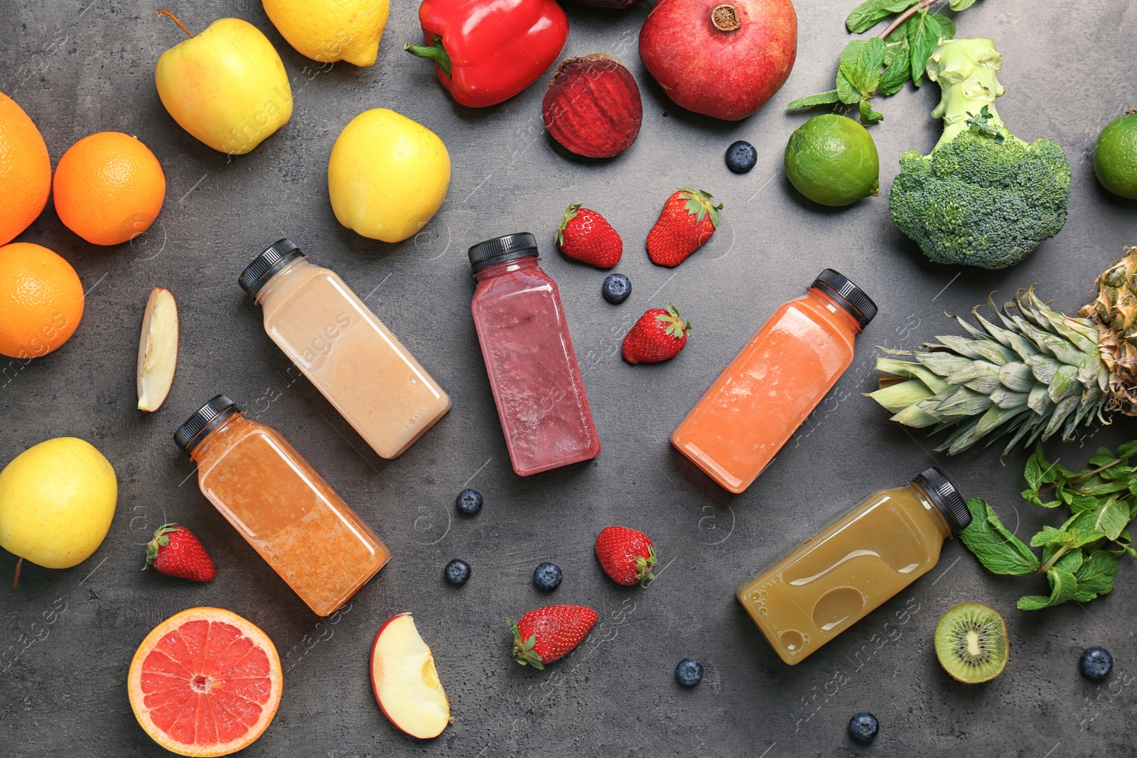 Photo of Flat lay composition with healthy detox smoothies and ingredients on grey background