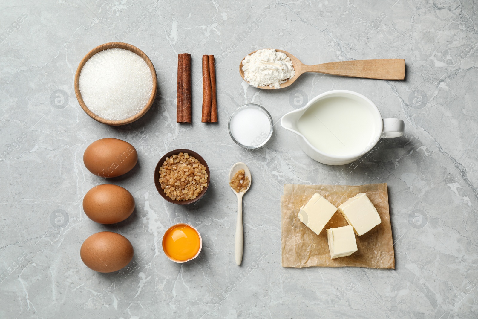 Photo of Flat lay composition with fresh ingredients for delicious homemade cake on light grey marble table