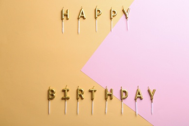 Flat lay composition with birthday candles on color background. Space for text