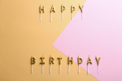 Photo of Flat lay composition with birthday candles on color background. Space for text