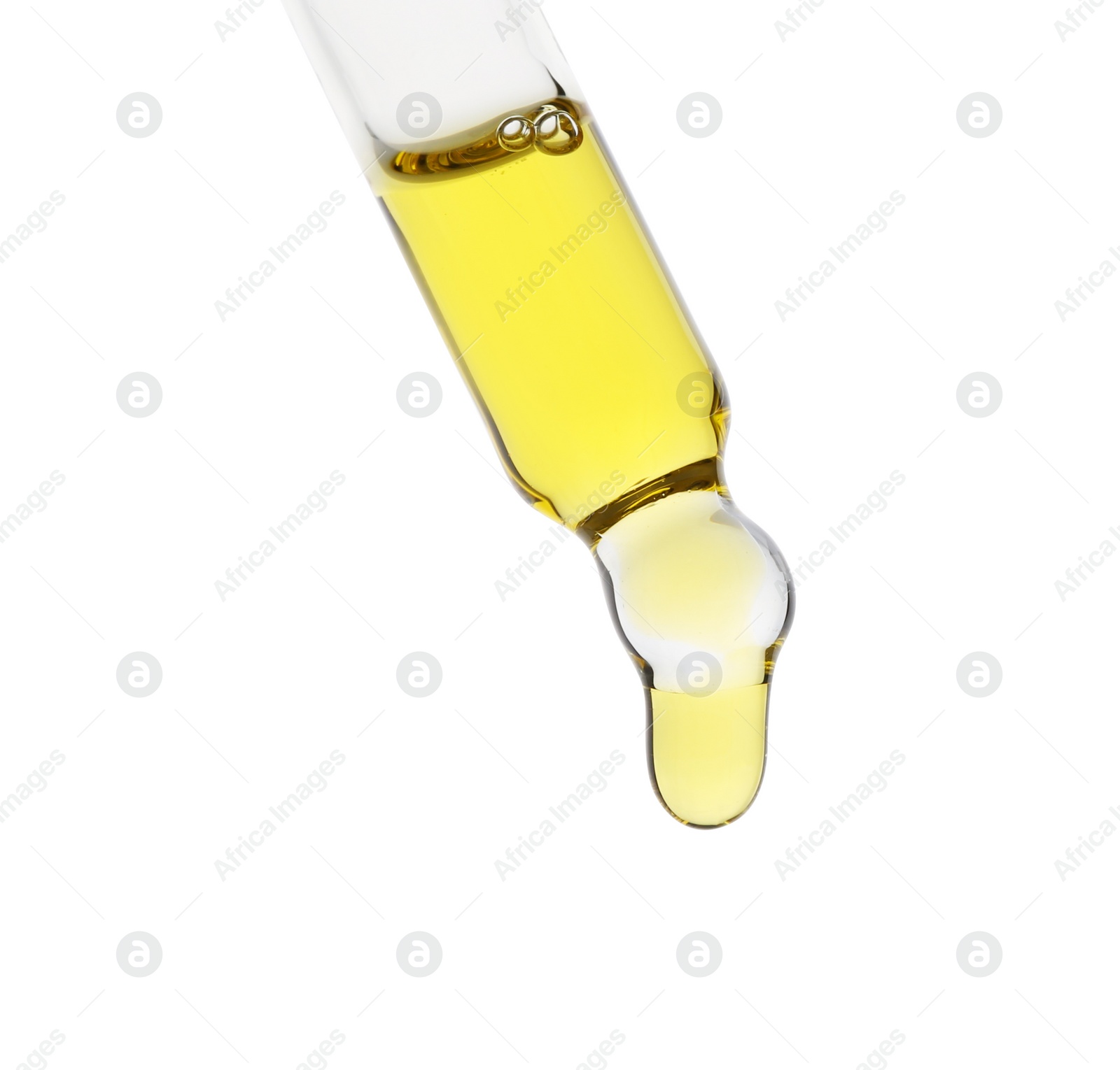 Photo of Dripping tincture from pipette isolated on white