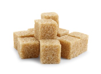 Many brown sugar cubes isolated on white