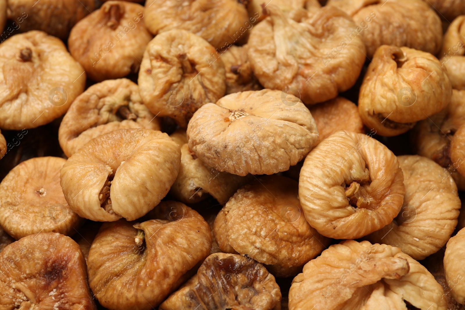 Photo of Many tasty dried figs as background, closeup