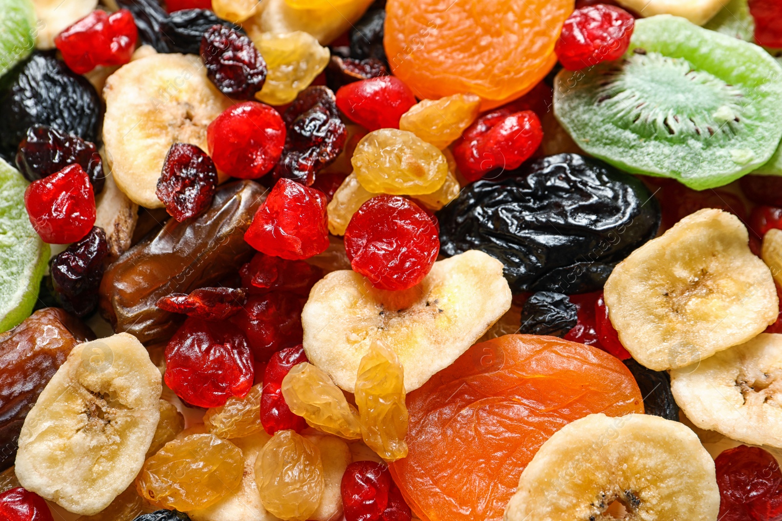 Photo of Different dried fruits as background, closeup. Healthy lifestyle
