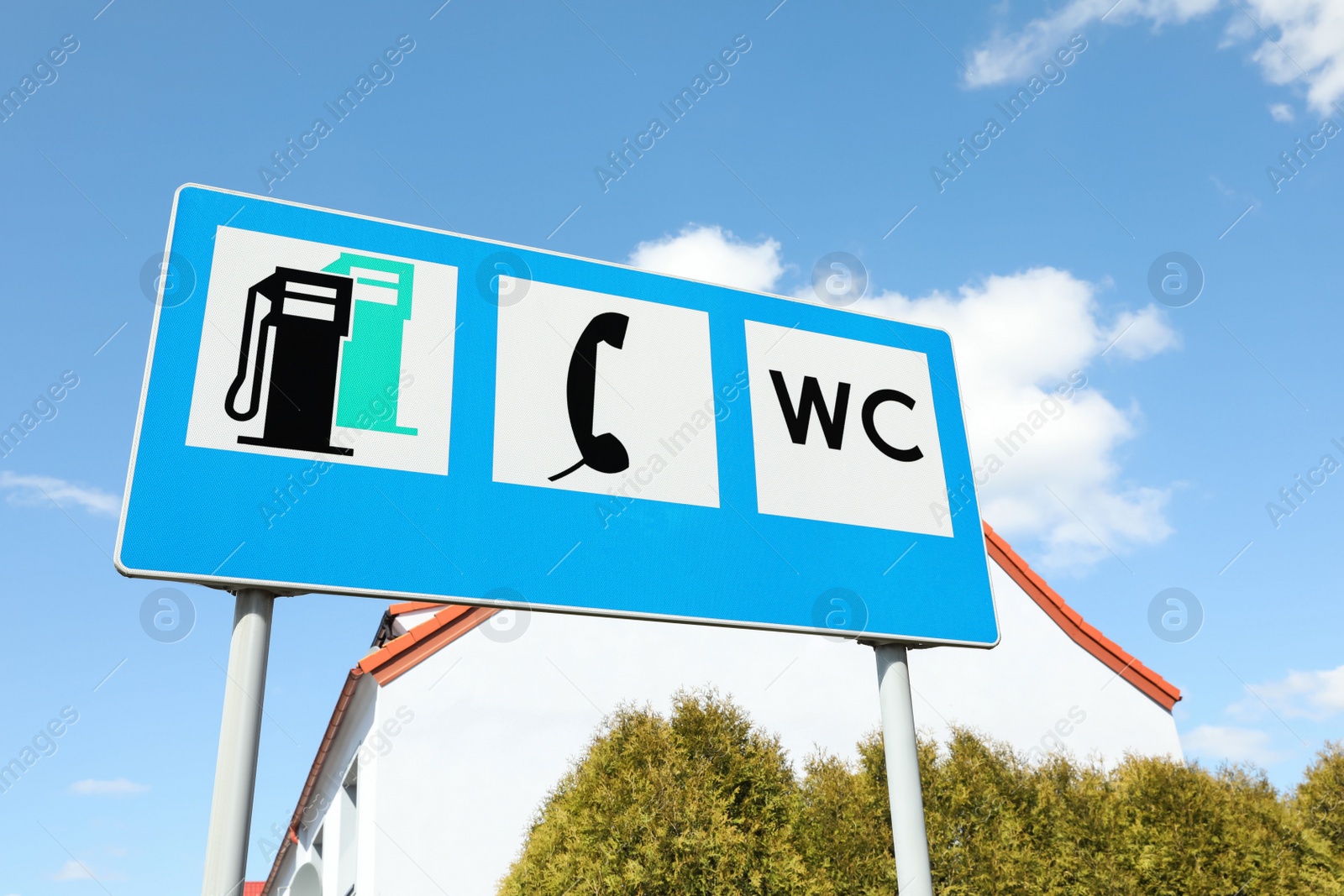 Photo of Different traffic signs on city street, low angle view