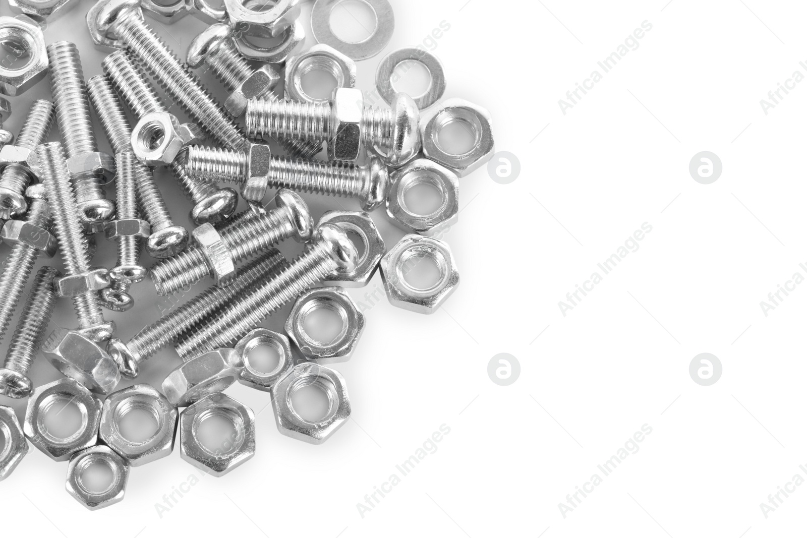 Photo of Many metal bolts and nuts on white background, top view