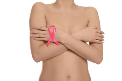 Photo of Naked woman with pink ribbon on white background, closeup. Breast cancer awareness