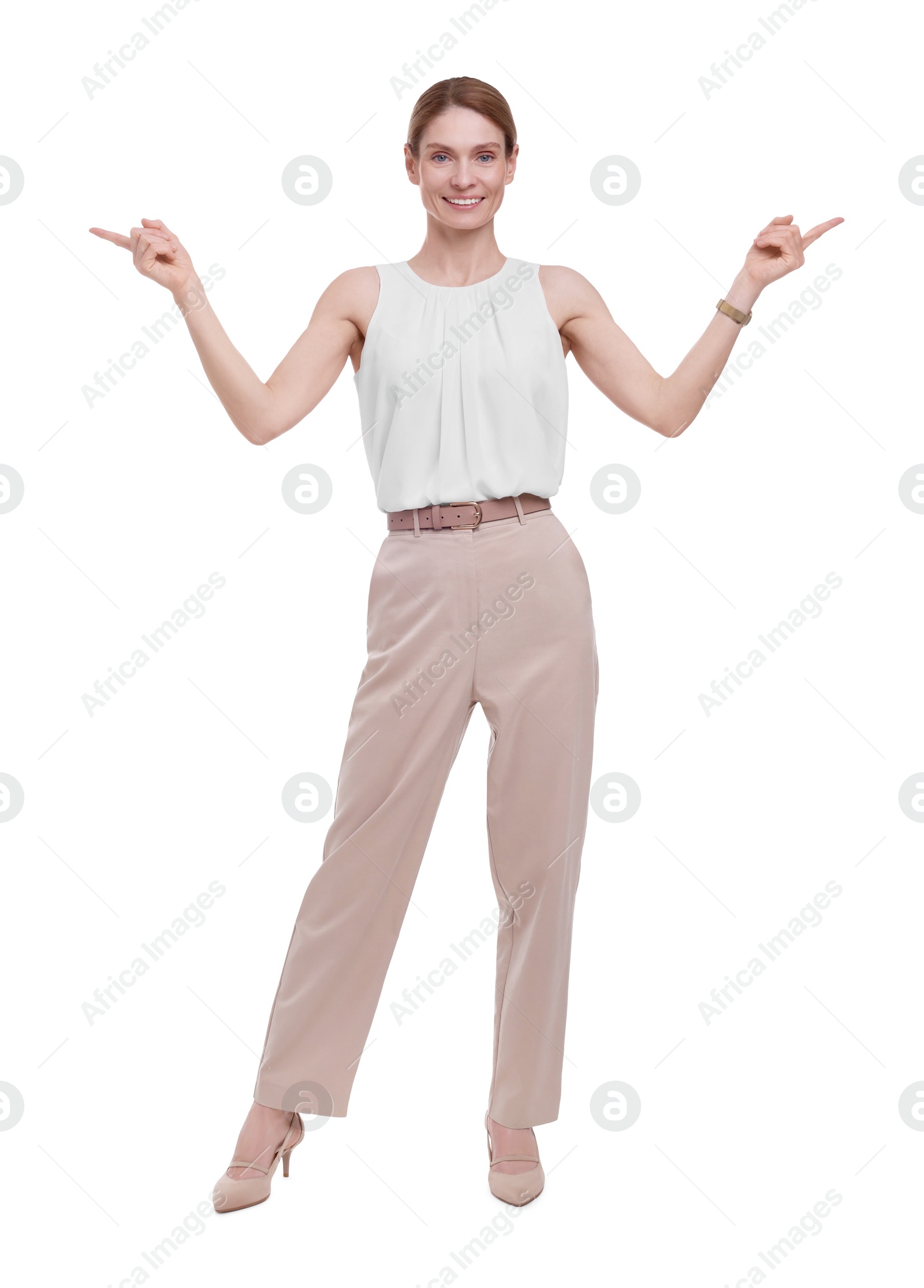 Photo of Beautiful happy businesswoman pointing at something on white background