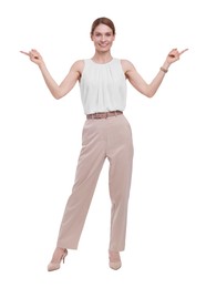 Photo of Beautiful happy businesswoman pointing at something on white background