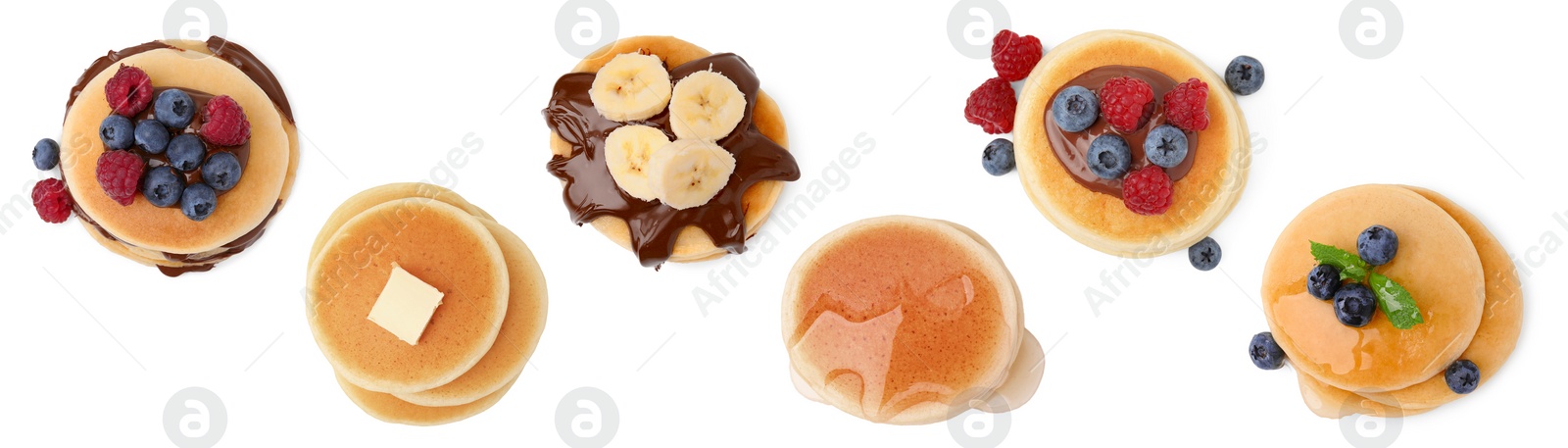 Image of Set of tasty pancakes with toppings isolated on white, top view