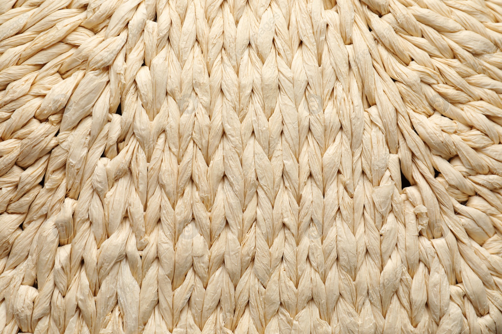 Photo of Elegant woman's straw bag as background, closeup