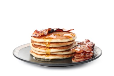 Delicious pancakes with maple syrup and fried bacon on white background