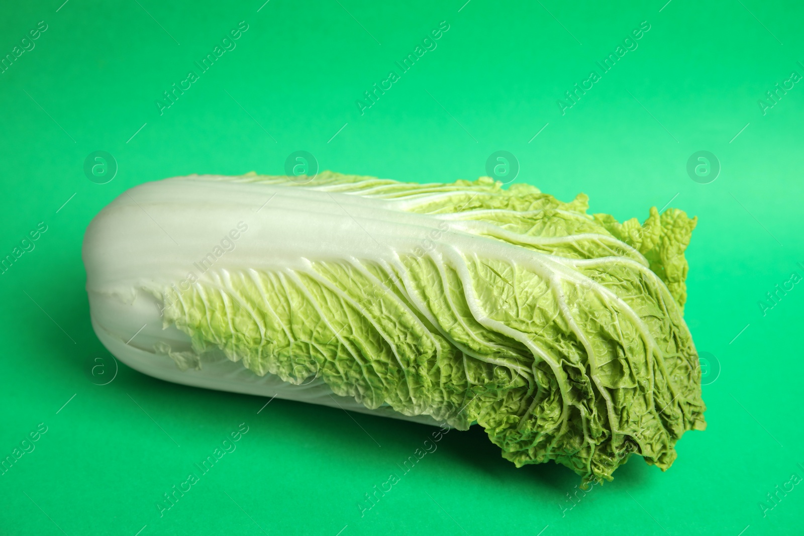 Photo of Fresh ripe cabbage on color background