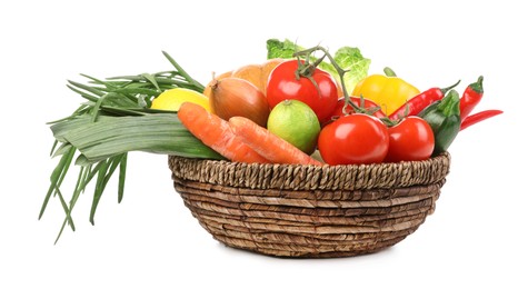 Photo of Fresh ripe vegetables and fruits in wicker bowl on white background