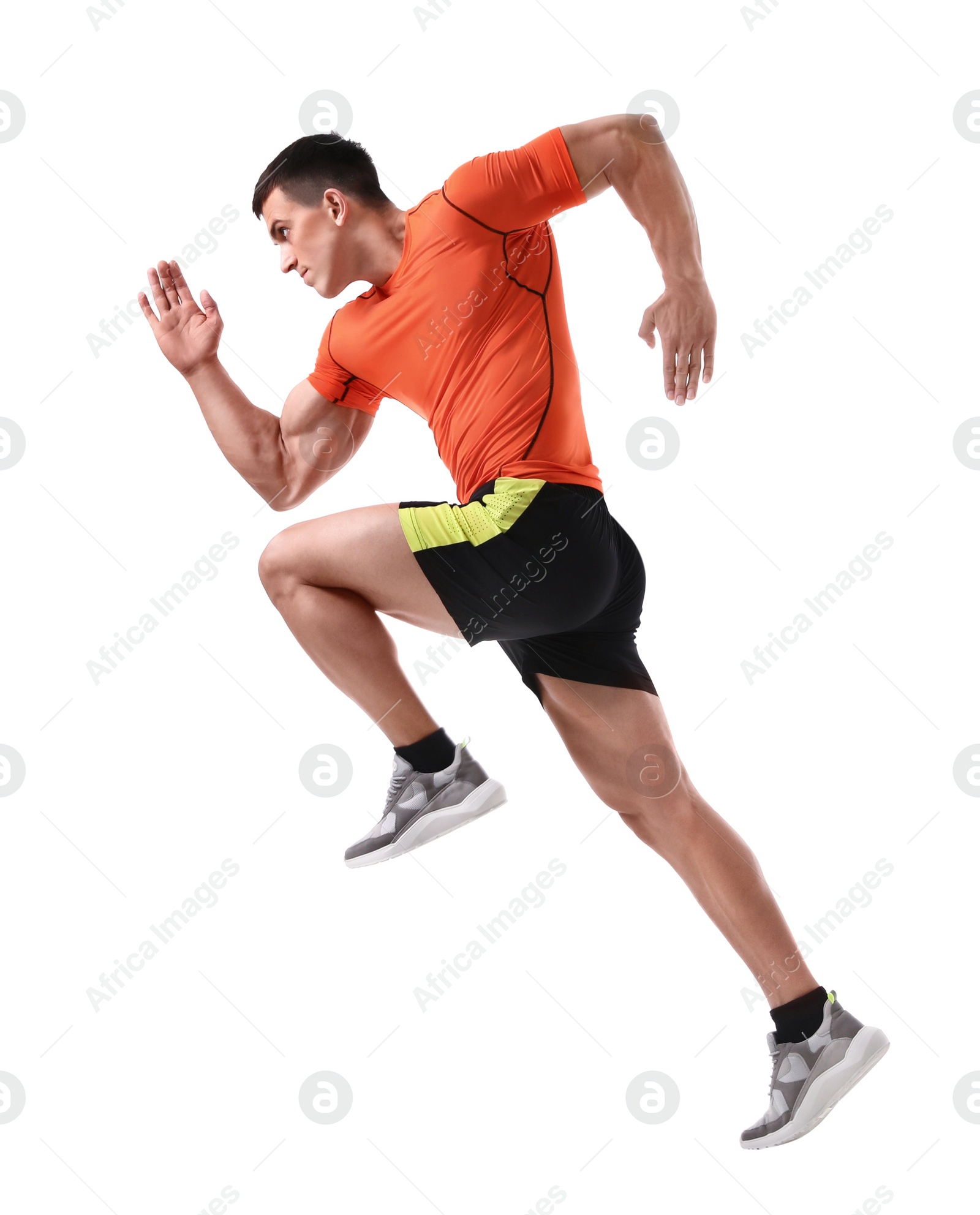 Photo of Athletic young man running on white background, side view